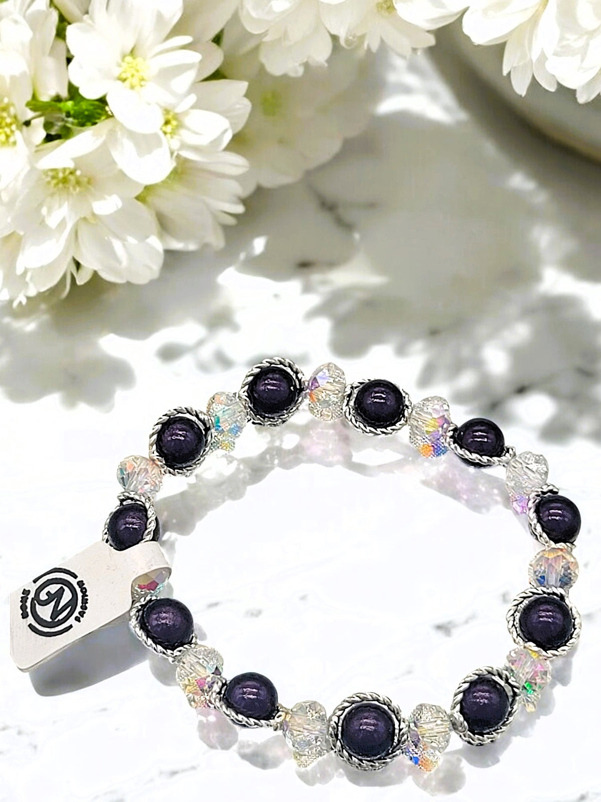 Besondere Magic-Pearls Armbänder mit zusätzl. Glasperlen in versch. Farben